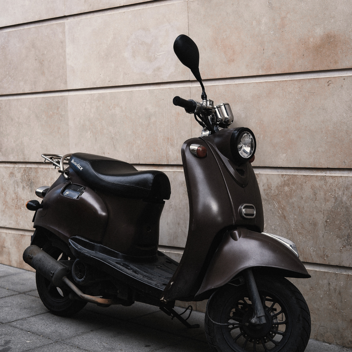 Electric scooter against a wall